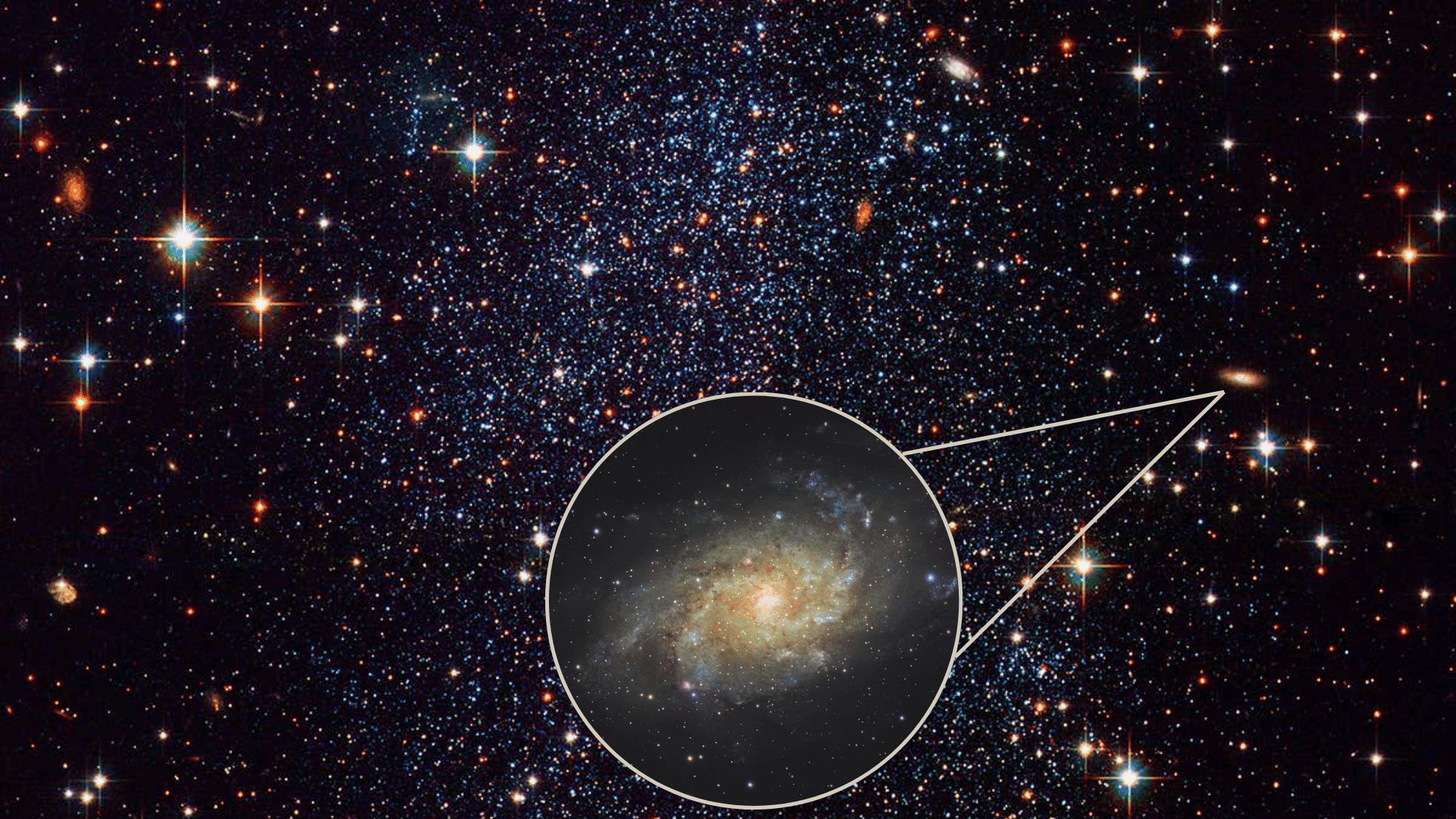 Deep space image representing the universe with a magnified inset circle highlighting spiral galaxy.
