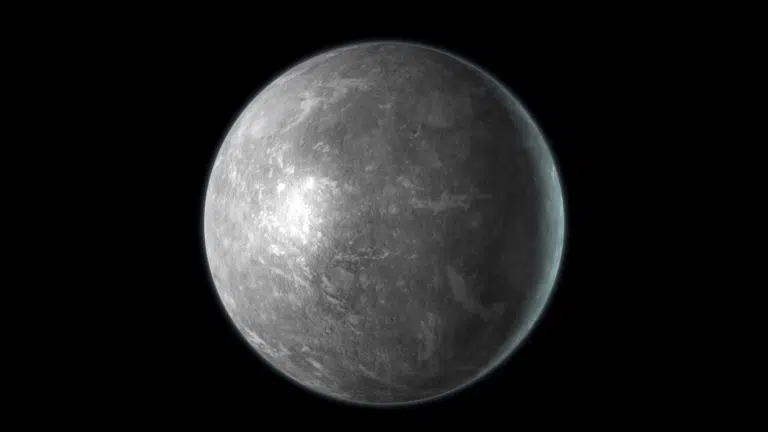 Gray, heavily cratered planet Mercury with a bright illuminated surface set against deep black spa