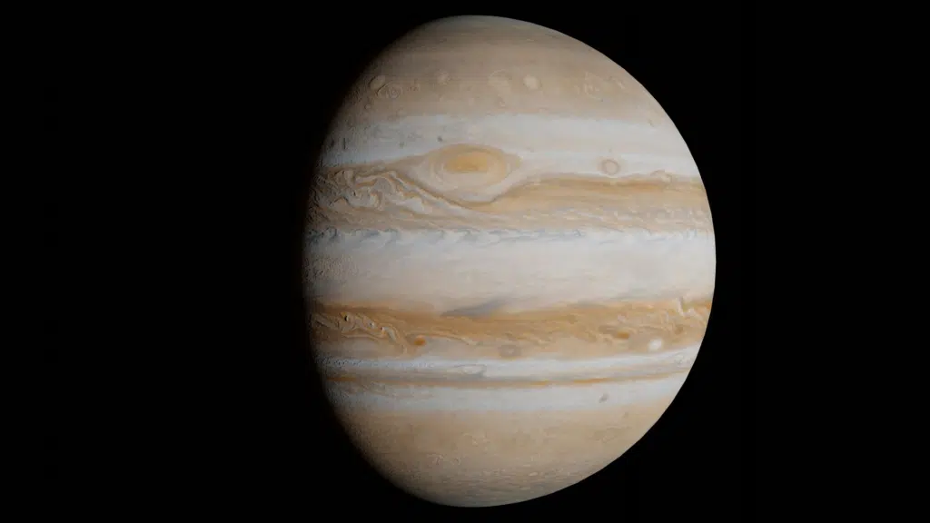 Jupiter planet's swirling beige, white, and brown cloud bands visible against deep black space