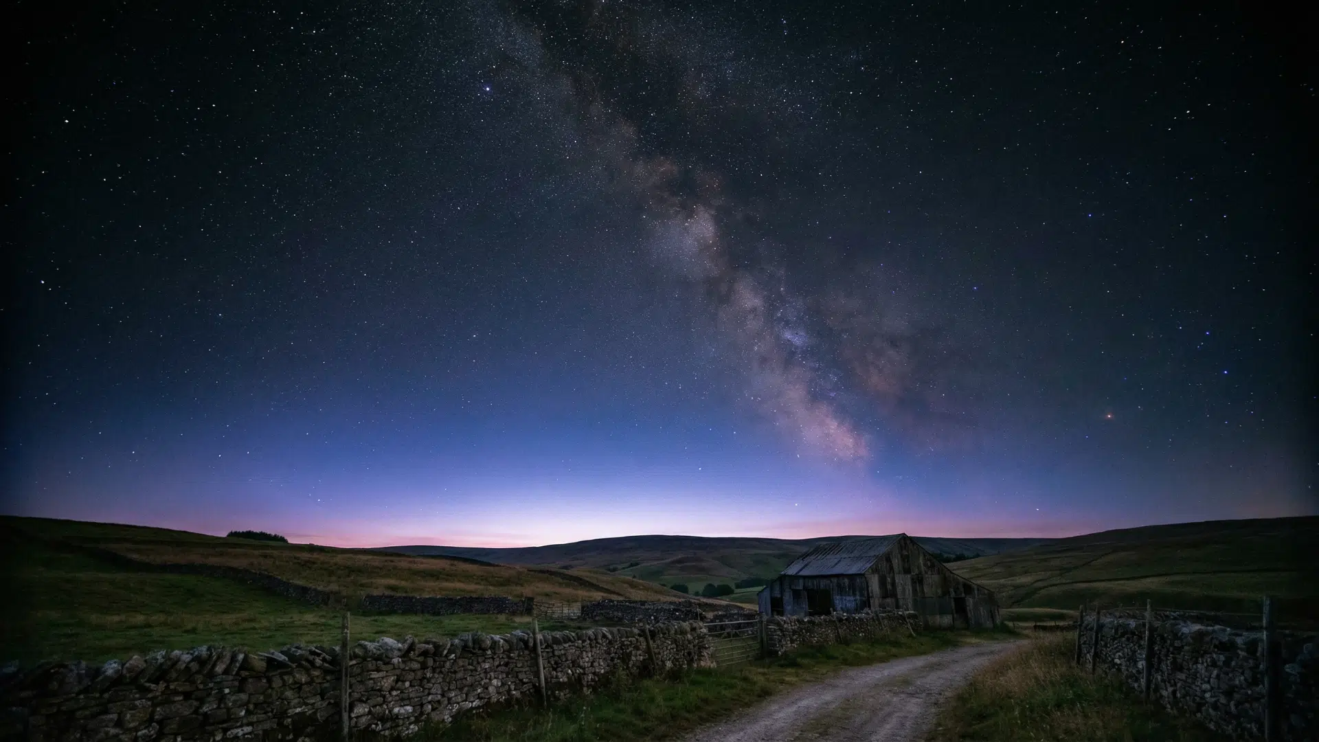 Rural landscape during astronomical twilight, very dark sky, Milky Way faintly visible, slight glow near horizon, no artificial lights
