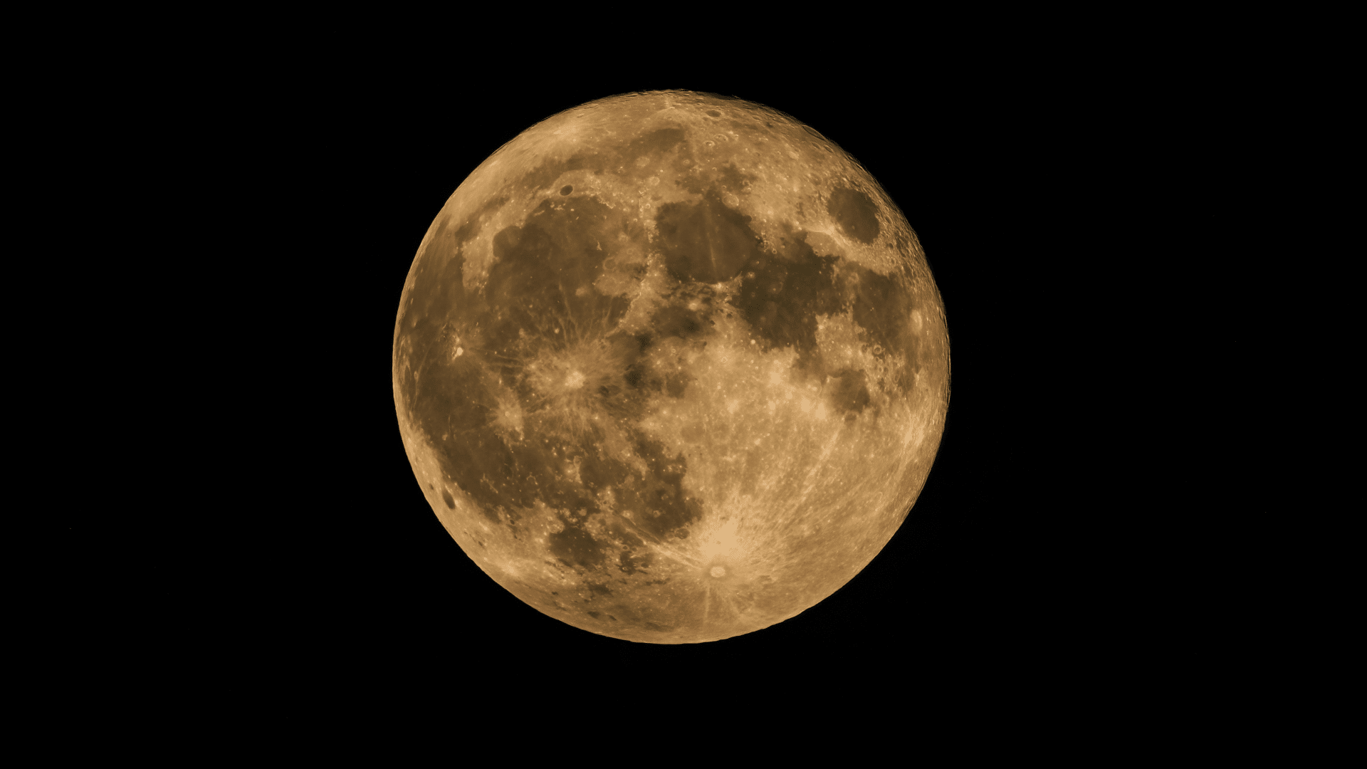 Bright yellowish moon visible against a dark background