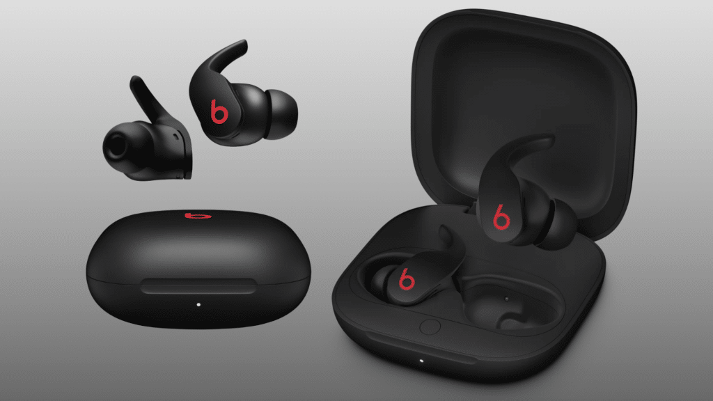 Black Beats Fit Pro wireless earbuds displayed with their charging case, both open and closed, against a gray background.