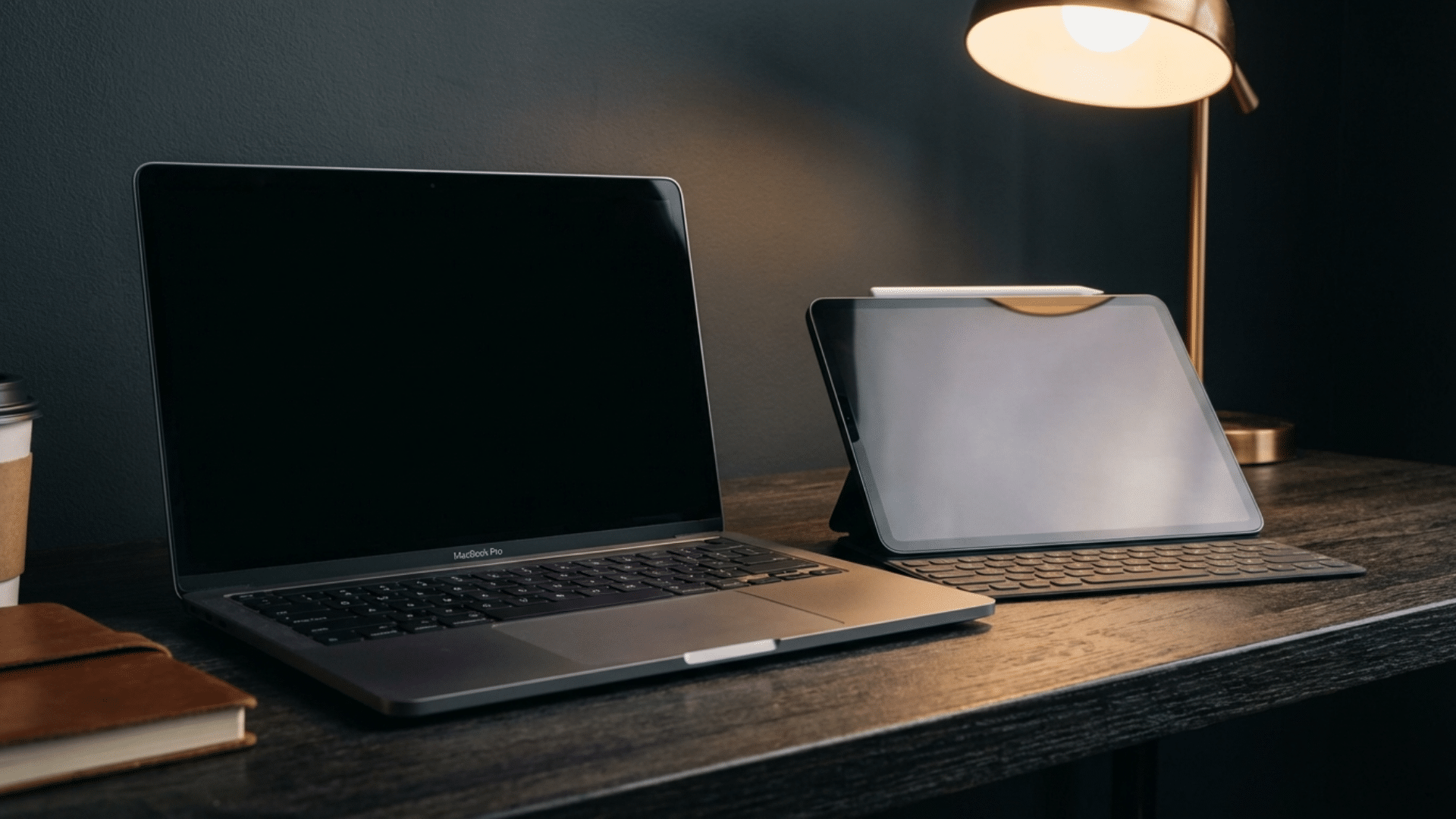 MacBook and iPad placed together highlighting decision between laptop and tablet devices