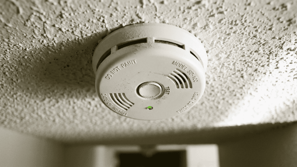 Smoke detectors shown on ceiling with simple clean design