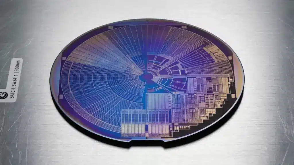 macro shot of a silicon wafer with iridescent circuit patterns on a brushed aluminum cleanroom surface