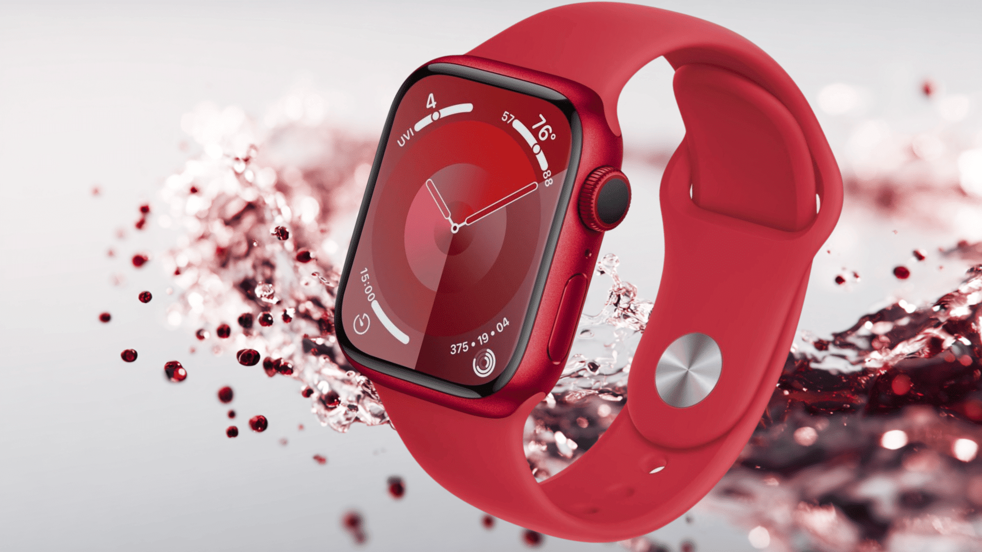A red Apple Watch Series 9 with a matching red sport band floats above a water splash against a clean white background
