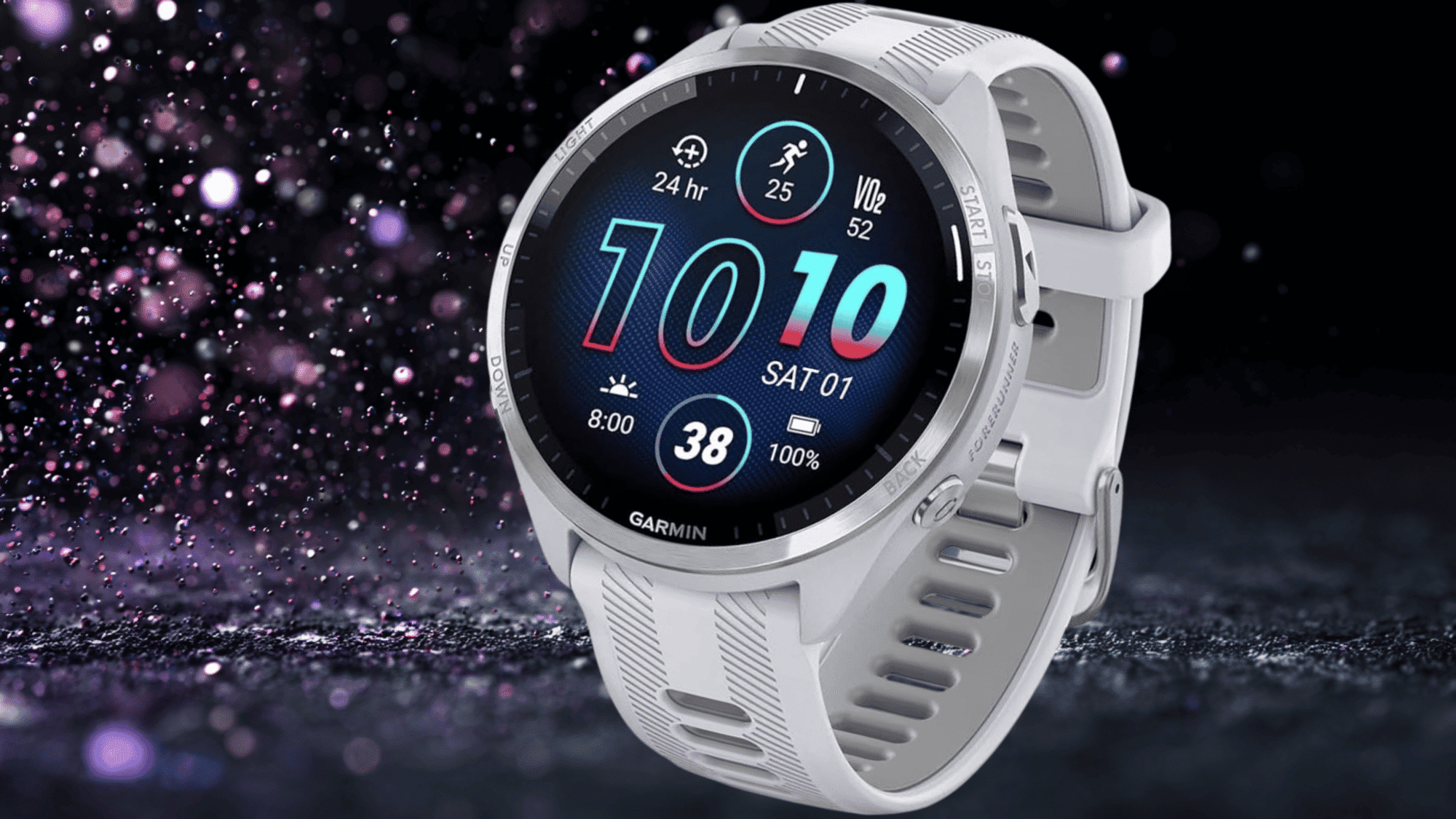 A white Garmin Forerunner 965 smartwatch displays workout stats including VO2 max, steps, and battery life against a dark glittery background