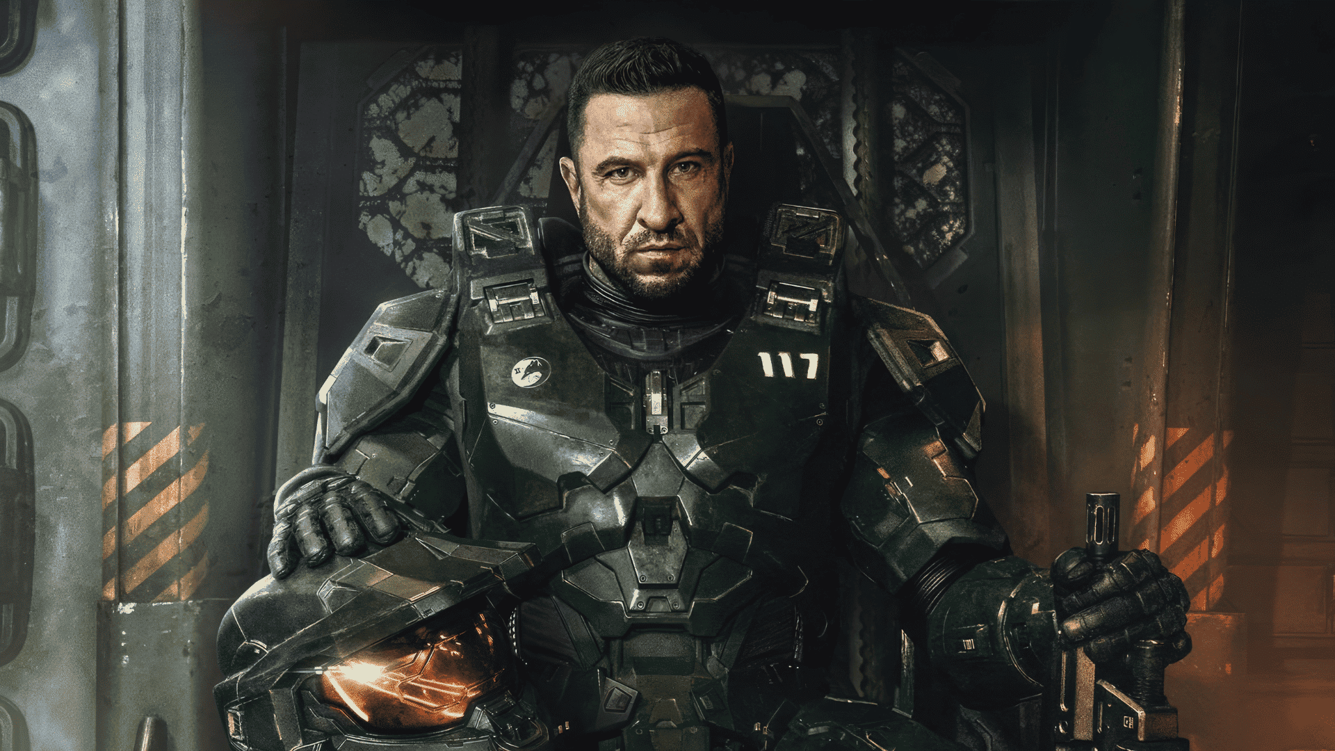 Pablo Schreiber as Master Chief in the Halo TV series wearing Spartan armor during an intense action scene