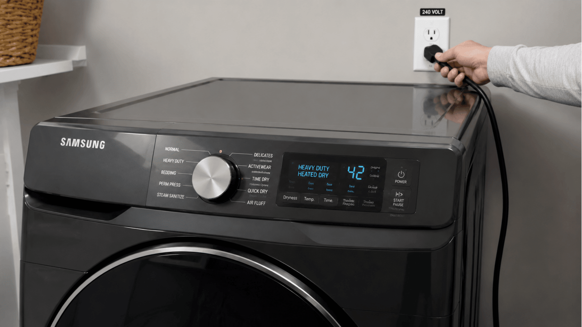 Samsung dryer control panel showing heated cycle a hand plugging dryer into 240 volt outlet in laundry room