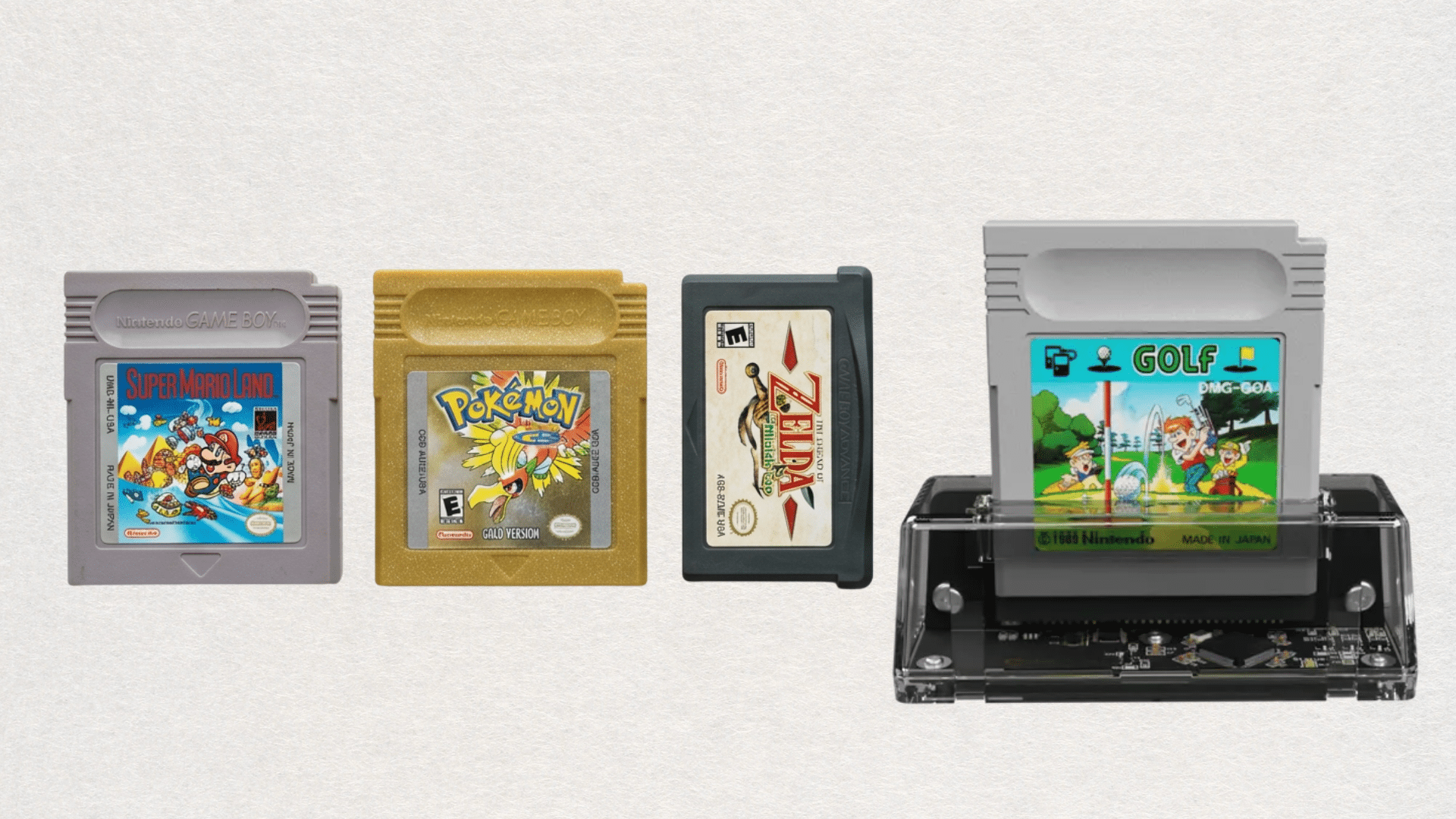 Game Boy, Game Boy Color, and Game Boy Advance cartridges displayed beside a GB Operator