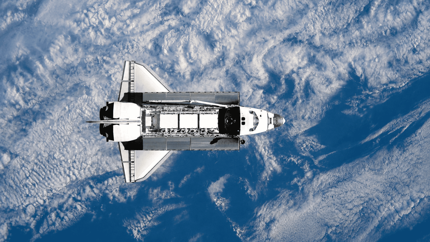 Orbiter spacecraft capturing high-resolution Earth images and data from orbit above atmosphere