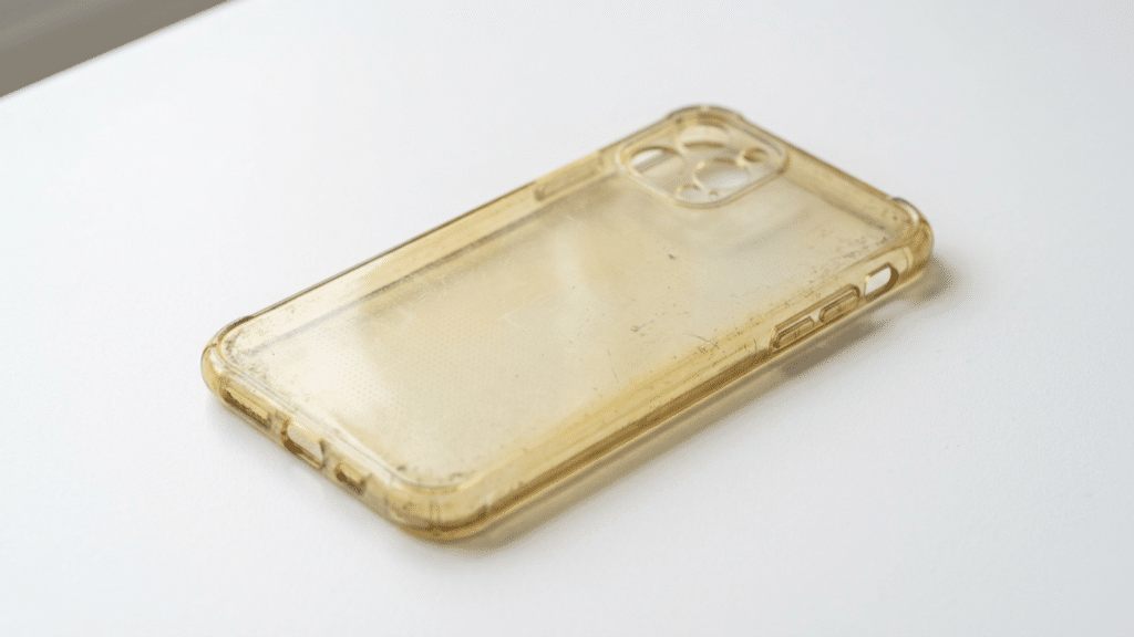 Yellowed clear phone case showing discoloration caused by age, sunlight exposure, and material degradation over time