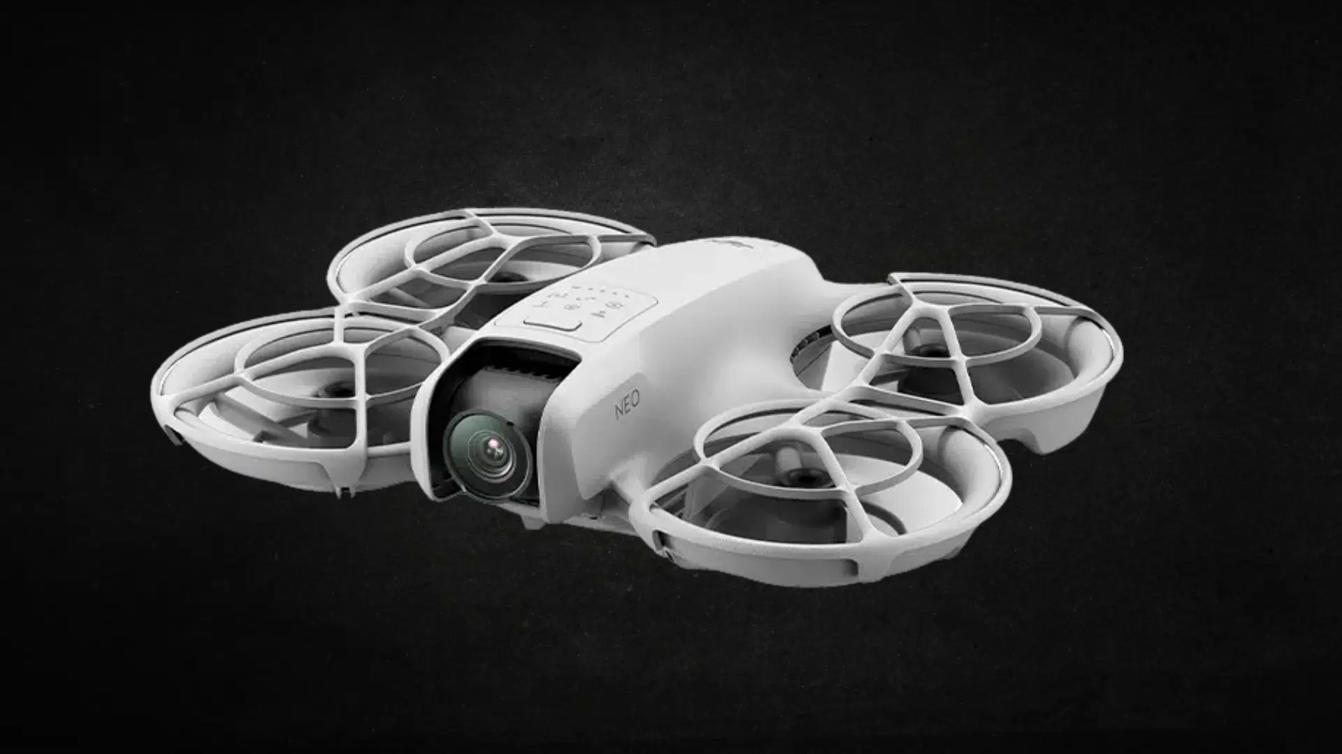 A white DJI Mini 3 Pro drone with a black background