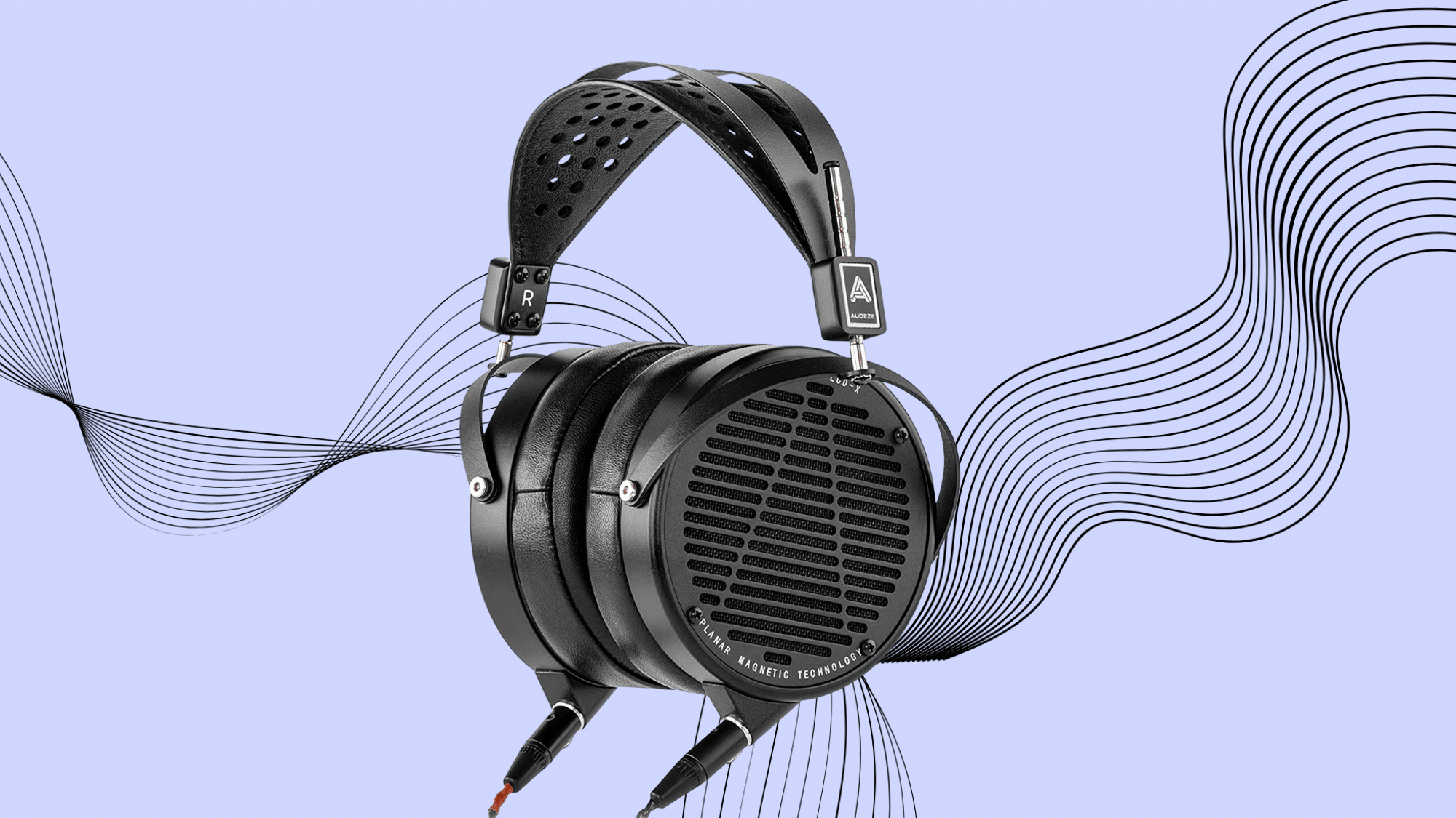 Audeze LCD-X open-back planar magnetic headphones with black finish on a light purple background.