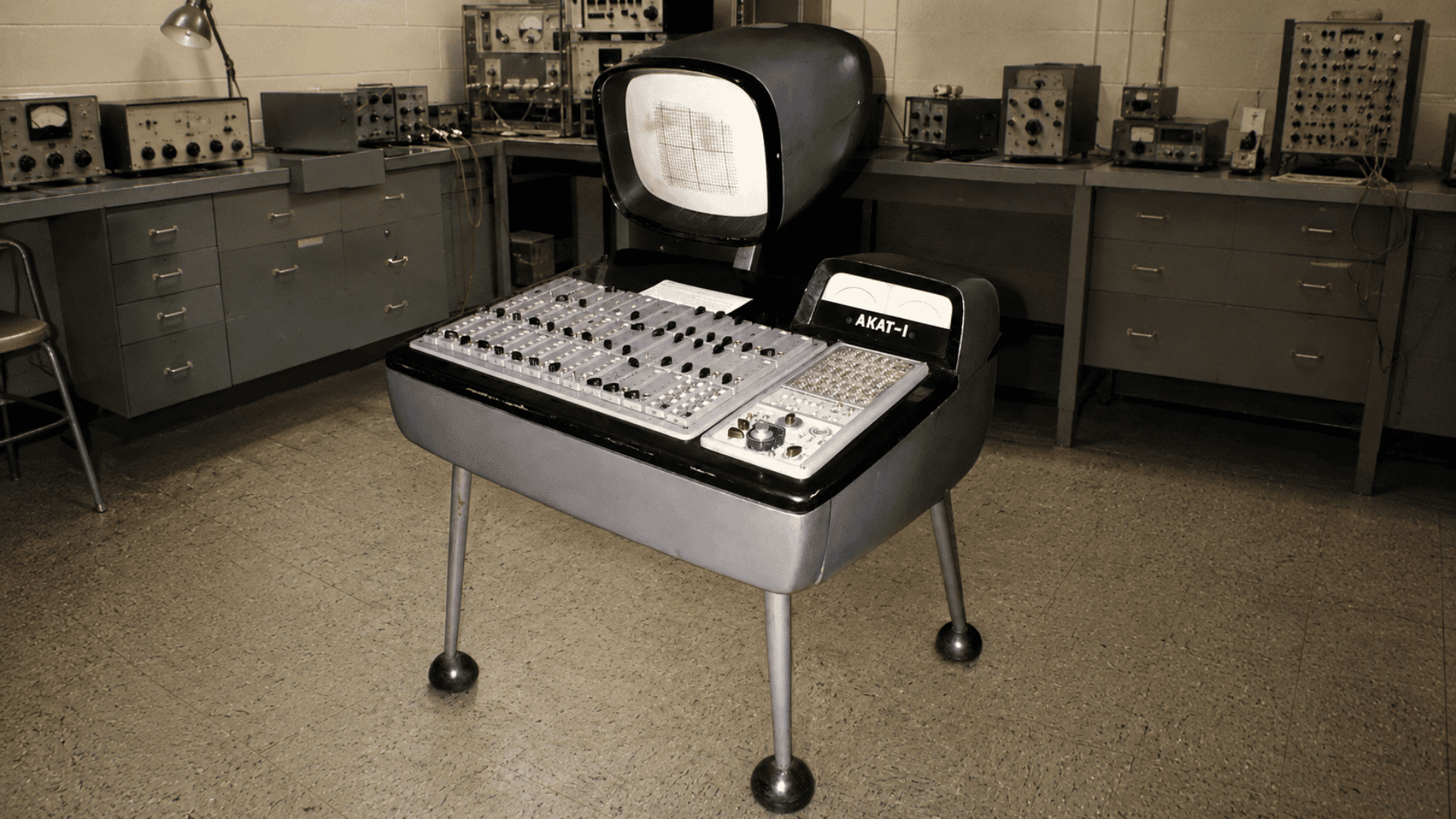 vintage AKAT-1 analog computer displayed in a mid-century engineering laboratory with electronic testing equipment