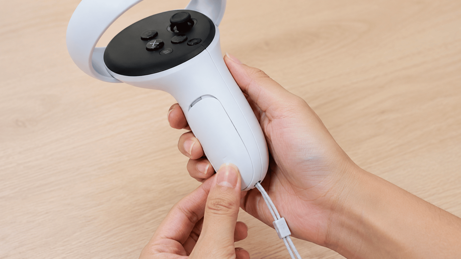 hands securing the battery cover on a Meta Quest 3 controller