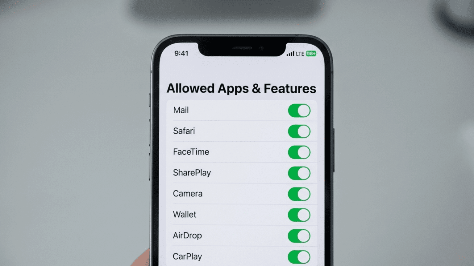 iPhone displaying parental control settings with Screen Time option