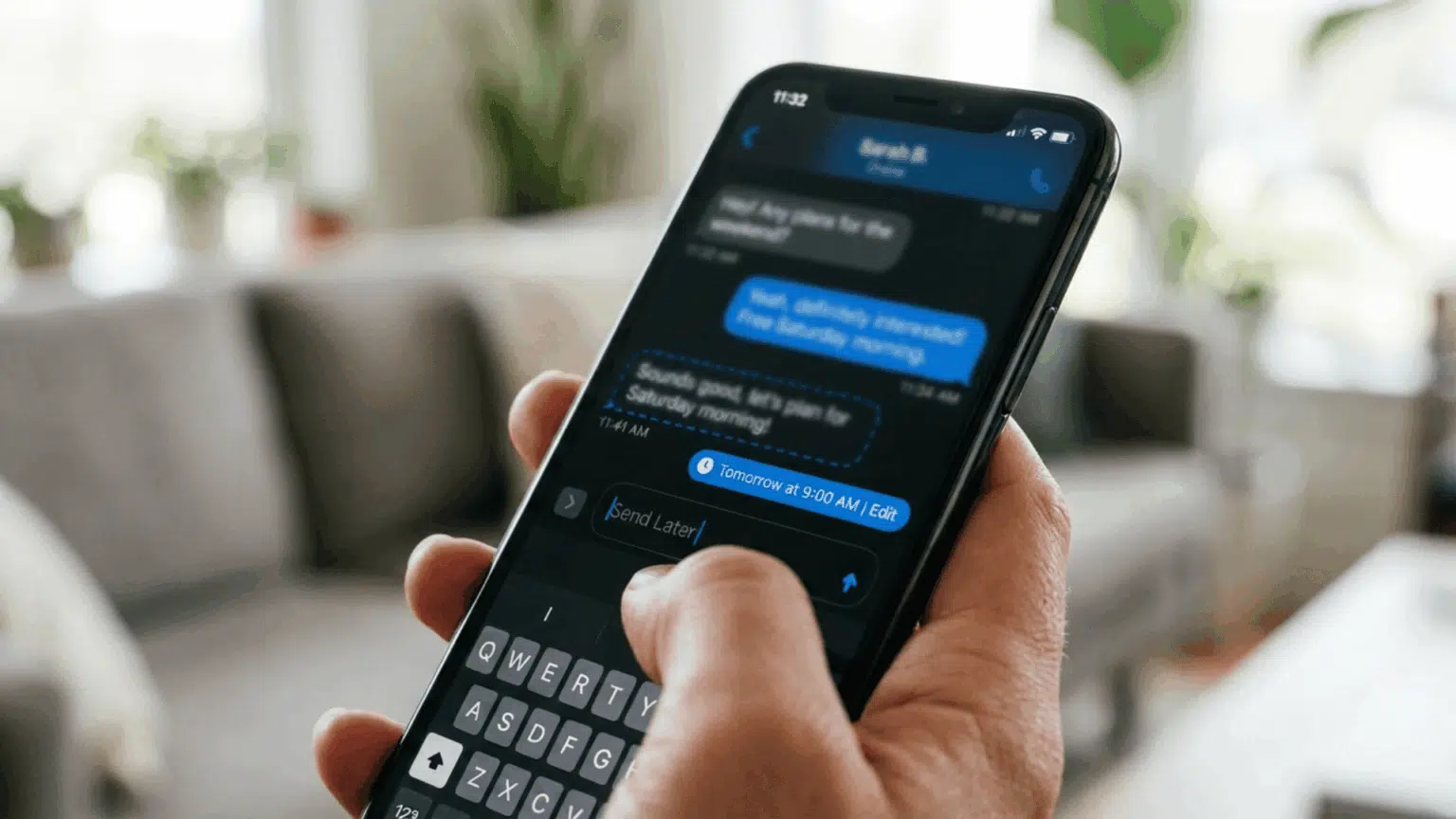 Hand holding an iPhone showing a scheduled message with dashed outline
