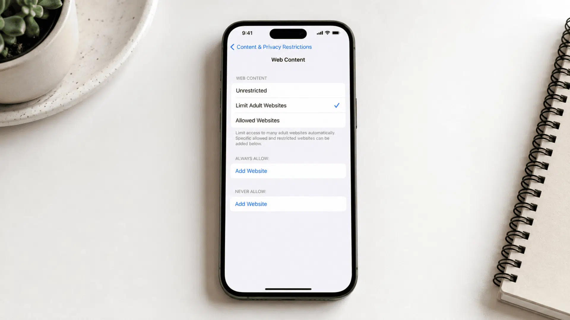 iPhone Web Content page with Limit Adult Websites selected
