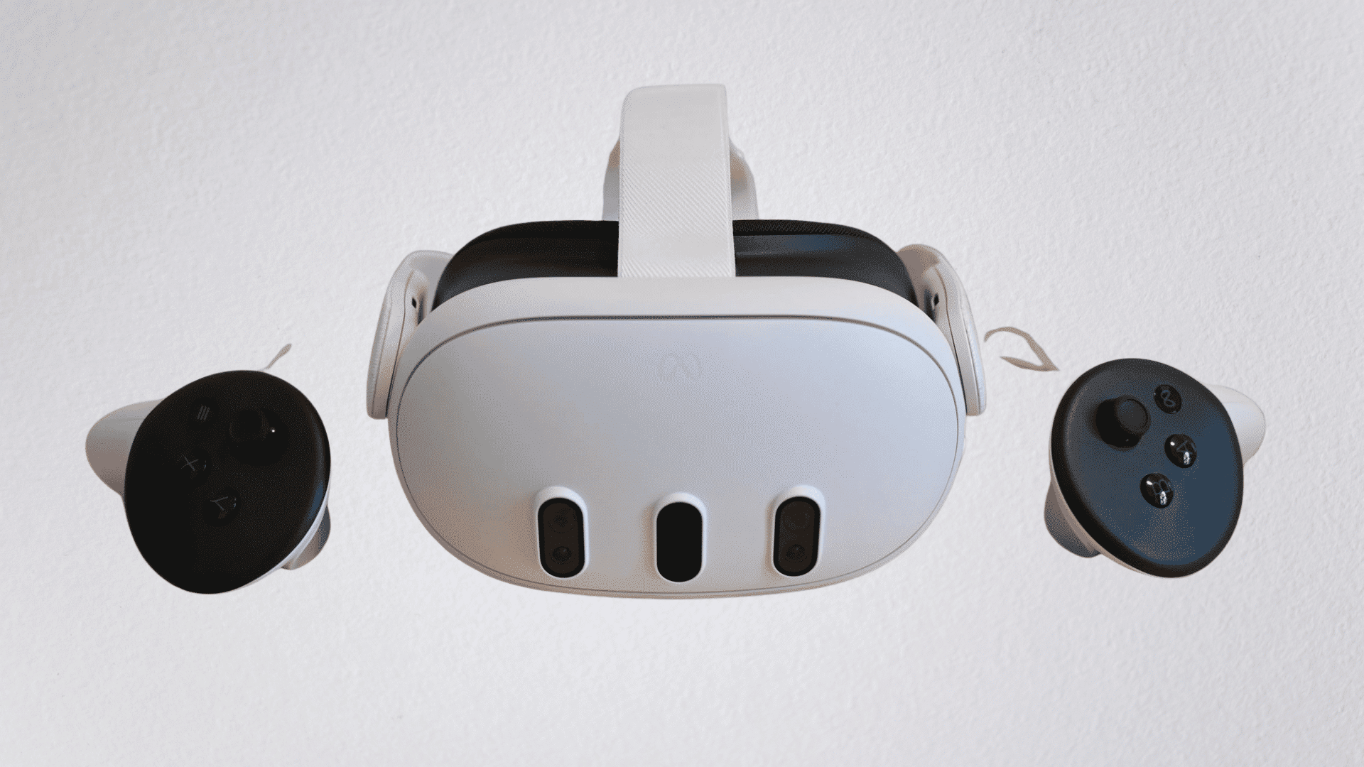 meta quest 3 vr headset with controllers displayed on a white background from the front view