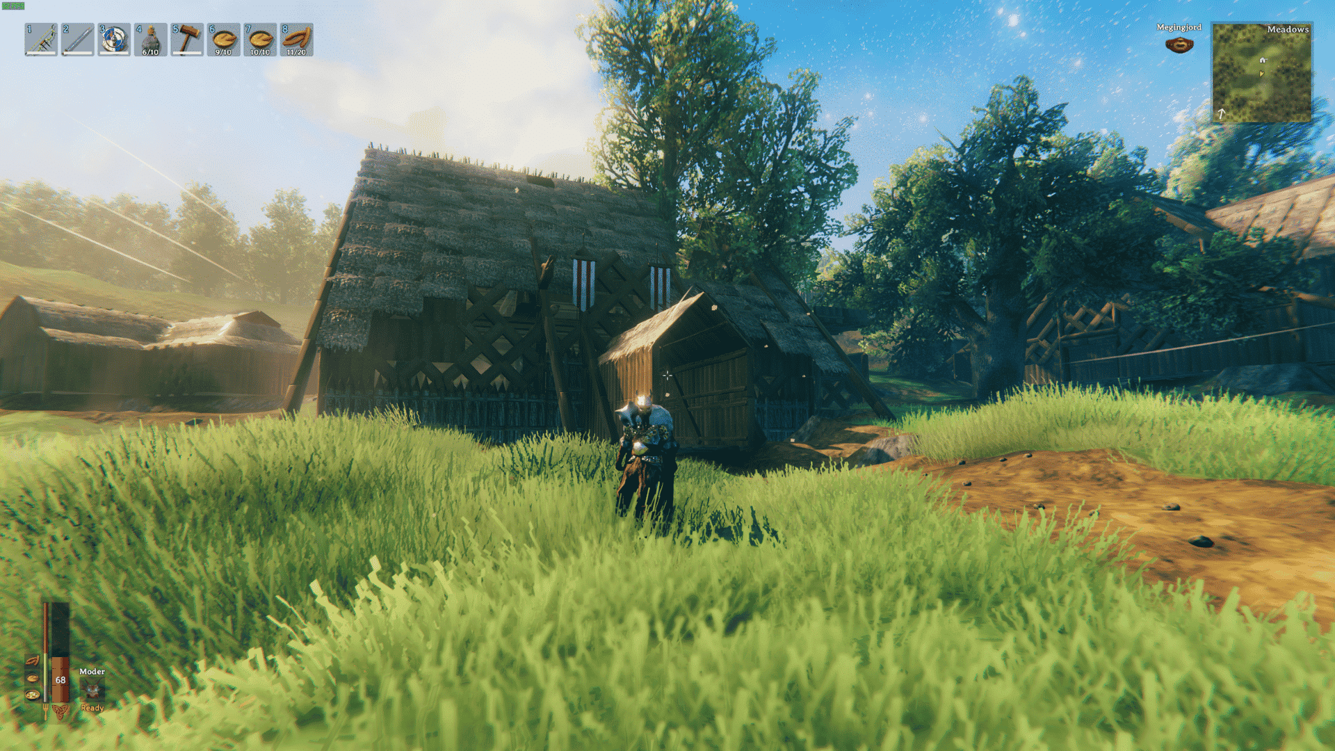 valheim warrior standing on a stone dock beside a ship and wooden coastal base